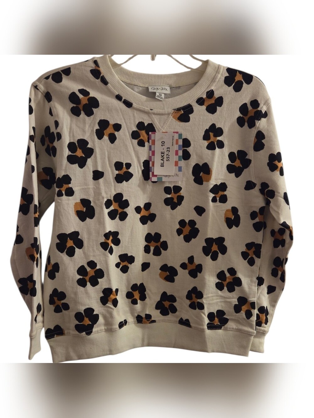 LuLaRoe Cream Sweatshirt with Black and Mustard Animal Print Spots